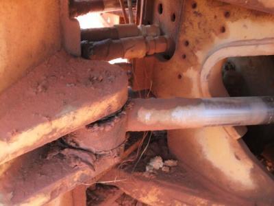 Construction Machinery Maintenance: Dirt Buildup, Hydraulic Piston, Pivot Point.
